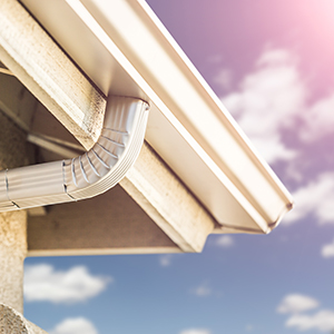 White gutters on a shingle roof